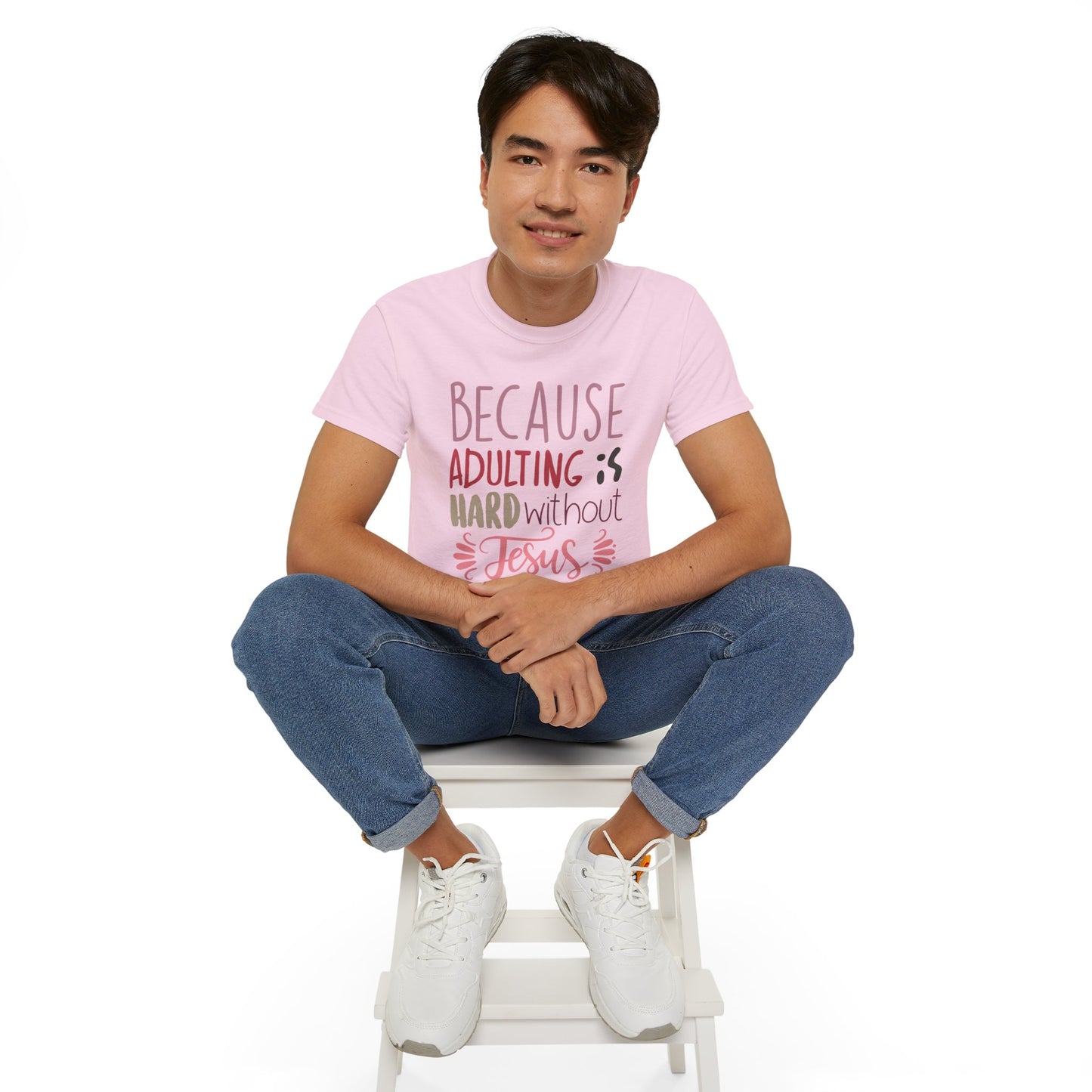 man in light pink shirt with words "Because Adulting is Hard without Jesus"