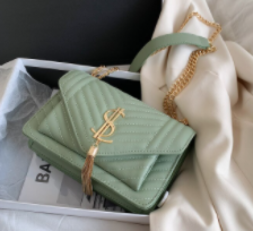 Green quilt pattern leather purse with metal "SL" Pattern design with Tassel. http://www.pandorajproductions.com/product-page/elf-love-hand-bags